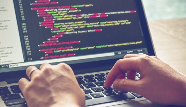 Programming Work Time. Programmer Typing New Lines of HTML Code. Laptop and Hand Closeup. Working Time. Web Design Business Concept.