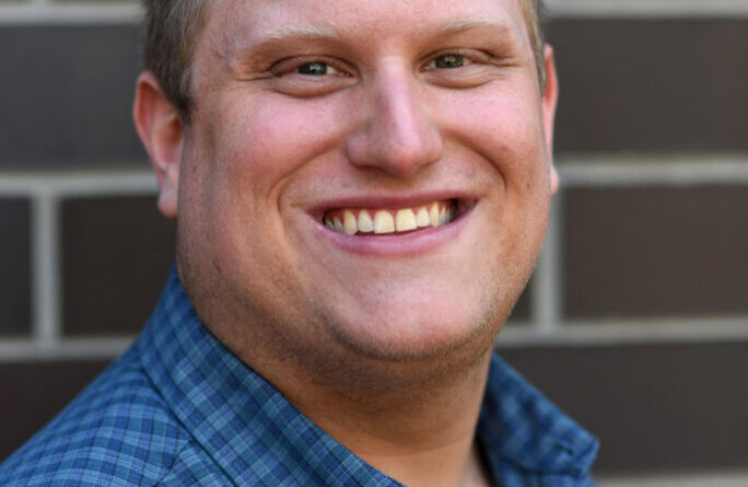 Man in blue shirt