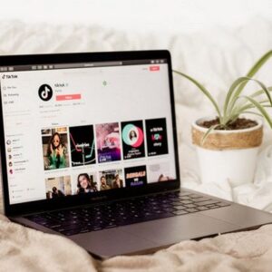 Blurry TikTok Logo on Top of Blurry Lines of Codes