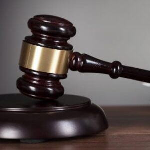 Robot and male human hand doing a fist bump. The man's writs has a white cuff visible.