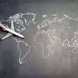 A model airplane on a world map