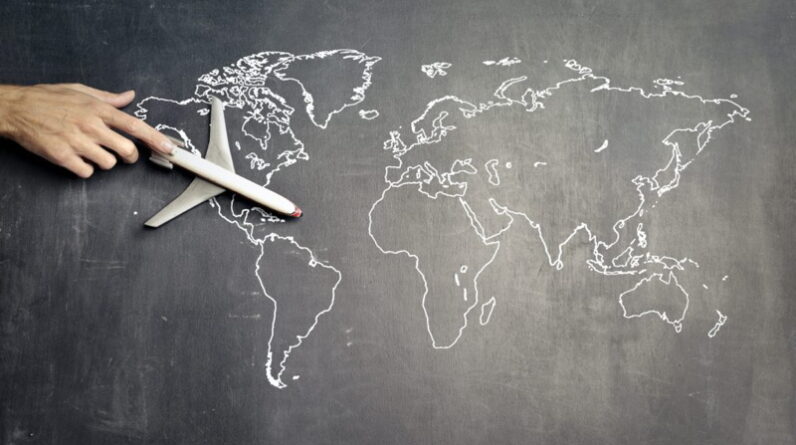 A model airplane on a world map
