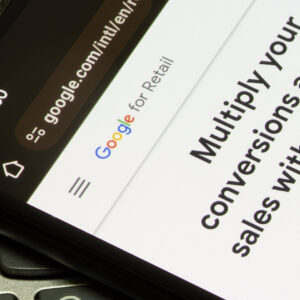 Introduction to Google Performance Max advertising campaigns is seen on the webpage of Google for Retail on a smartphone.