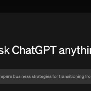 Close-up of a man holding binoculars in mountains.