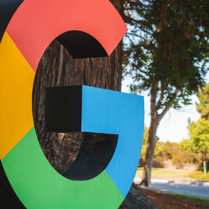 D letter 'G' resembling Google logo colors outdoors in a park like setting. No specific location provided, possibly near Google office or campus.