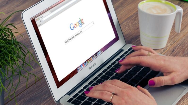 Person searching the web on their laptop